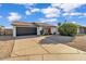 Single-story home with red door and black garage door at 3406 E Libby St, Phoenix, AZ 85032