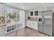 Modern kitchen with stainless steel appliances and access to the backyard at 3406 E Libby St, Phoenix, AZ 85032