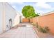 Landscaped side yard with tile pathway and small plants at 8634 E Monterosa Ave, Scottsdale, AZ 85251