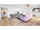 Living room with hardwood floors, pink sofa, and mid-century modern style at 8634 E Monterosa Ave, Scottsdale, AZ 85251