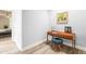 Mid century modern vanity with wood desk and blue pouf at 8634 E Monterosa Ave, Scottsdale, AZ 85251