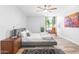 Bright bedroom with ceiling fan and large window at 8634 E Monterosa Ave, Scottsdale, AZ 85251