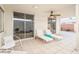 Relaxing patio with lounge chairs and ceiling fan at 8634 E Monterosa Ave, Scottsdale, AZ 85251