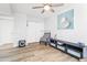 Bedroom with wood floors, a chair, and a large piece of art at 8634 E Monterosa Ave, Scottsdale, AZ 85251
