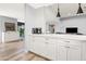 White kitchen with quartz countertops and modern pendant lights at 8634 E Monterosa Ave, Scottsdale, AZ 85251