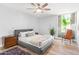 Spacious bedroom with ceiling fan and large window at 8634 E Monterosa Ave, Scottsdale, AZ 85251