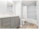 Double vanity bathroom with gray cabinets and white countertop at 8634 E Monterosa Ave, Scottsdale, AZ 85251