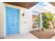 Bright entryway with blue door and desert landscaping at 8634 E Monterosa Ave, Scottsdale, AZ 85251