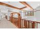 Spacious upper hallway with wooden railings and a chandelier at 13118 N Founders Park Blvd, Surprise, AZ 85379