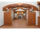 Living room with a fireplace and wood beams at 13118 N Founders Park Blvd, Surprise, AZ 85379