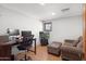 Home office with a desk, laptop, and comfortable seating at 13118 N Founders Park Blvd, Surprise, AZ 85379