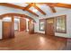 Spacious entryway with wood beams, arched entry, and wood flooring at 13118 N Founders Park Blvd, Surprise, AZ 85379