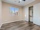 Bedroom with wood-look floors and large closet at 7054 E Ingram St, Mesa, AZ 85207
