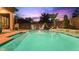 Inviting swimming pool with a tranquil waterfall feature at 7054 E Ingram St, Mesa, AZ 85207