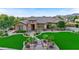 Stunning home with a lush green lawn and mountain views at 7054 E Ingram St, Mesa, AZ 85207