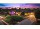 Luxury property at dusk, showcasing a large home with meticulously landscaped front yard at 7054 E Ingram St, Mesa, AZ 85207