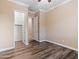 Well-lit bedroom with wood-look floors and closet at 7054 E Ingram St, Mesa, AZ 85207