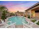 Luxury backyard with a large pool, patio, and outdoor kitchen at 7054 E Ingram St, Mesa, AZ 85207