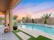 Spacious backyard with a refreshing pool and a covered patio at 7054 E Ingram St, Mesa, AZ 85207