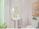 Small bathroom with pedestal sink and decorative art at 2030 E Michigan Ave # 24, Phoenix, AZ 85022