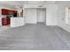 Spacious living room with carpet and kitchen access at 17017 N 12Th St # 2124, Phoenix, AZ 85022