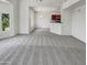 Spacious living room with carpet flooring and view to kitchen at 17017 N 12Th St # 2124, Phoenix, AZ 85022