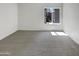 Empty bedroom with a large window and carpet at 17017 N 12Th St # 2124, Phoenix, AZ 85022