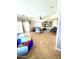 Gathering room with comfortable seating and access to backyard at 17473 W Elizabeth Ave, Goodyear, AZ 85338