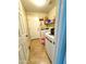 Laundry room with washer, dryer, and extra storage at 17473 W Elizabeth Ave, Goodyear, AZ 85338
