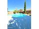 Inviting kidney-shaped pool with surrounding patio at 17473 W Elizabeth Ave, Goodyear, AZ 85338