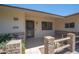 House exterior featuring a brick walkway, security door, and manicured landscaping at 10802 W Cameo Dr, Sun City, AZ 85351
