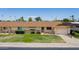 Ranch style home with a two car garage and grassy yard at 10802 W Cameo Dr, Sun City, AZ 85351