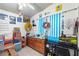 Bright bedroom with a dresser, desk, and colorful decor at 8865 E Baseline Rd # 128, Mesa, AZ 85209