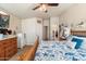 Main bedroom with king bed, dresser, and access to the bathroom and hallway at 8865 E Baseline Rd # 128, Mesa, AZ 85209
