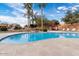 Inviting community pool with a rock waterfall feature at 8865 E Baseline Rd # 128, Mesa, AZ 85209