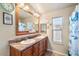 Bathroom with dual sinks, large vanity, and a tiled floor at 8865 E Baseline Rd # 128, Mesa, AZ 85209