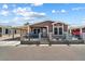 Attractive manufactured home with carport and fenced yard at 8865 E Baseline Rd # 128, Mesa, AZ 85209