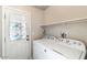 Clean laundry room with washer, dryer, and exterior access at 8865 E Baseline Rd # 128, Mesa, AZ 85209
