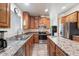 Kitchen boasts stainless steel appliances, ample cabinetry, and a corner sink at 8865 E Baseline Rd # 128, Mesa, AZ 85209