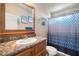 Bathroom features a single sink, shower/tub combo, and decorative shower curtain at 8865 E Baseline Rd # 128, Mesa, AZ 85209