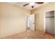 Bedroom with ceiling fan and access to another room at 13820 W Cheery Lynn Rd, Avondale, AZ 85392
