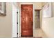 Inviting entryway with rich wood door and sidelights, leading to the interior at 13820 W Cheery Lynn Rd, Avondale, AZ 85392