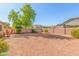 Backyard with gravel, trees, and a hammock at 13820 W Cheery Lynn Rd, Avondale, AZ 85392