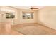 Spacious living room with a ceiling fan and large window at 13820 W Cheery Lynn Rd, Avondale, AZ 85392