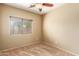 Bright bedroom with carpeted floor and window coverings at 13820 W Cheery Lynn Rd, Avondale, AZ 85392