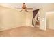 Spacious bedroom with ceiling fan and ensuite bathroom at 13820 W Cheery Lynn Rd, Avondale, AZ 85392