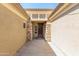 Elegant entryway with stone columns and wrought iron door at 13820 W Cheery Lynn Rd, Avondale, AZ 85392