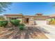 One-story home with a two-car garage and desert landscaping at 13820 W Cheery Lynn Rd, Avondale, AZ 85392