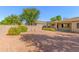 Backyard with gravel, shrubs, and a block wall at 13820 W Cheery Lynn Rd, Avondale, AZ 85392