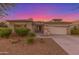 One-story home with a two-car garage and desert landscaping at 13820 W Cheery Lynn Rd, Avondale, AZ 85392